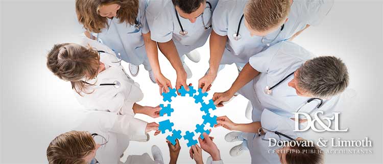 Dental team joining puzzle pieces in a huddle